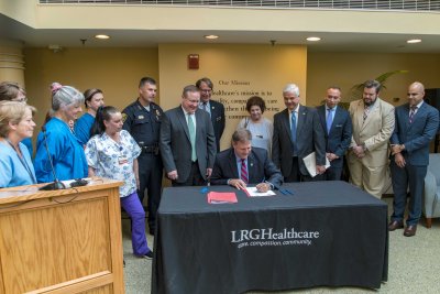 Governor Chris Sununu's signing HB 1791 and SB 376 with patient advocacy groups, doctors, hospital officials, members of law enforcement, lawmakers and patients prior to signing  at Lakes Region General Hospital in Laconia