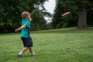 Child throwing a frisbee.